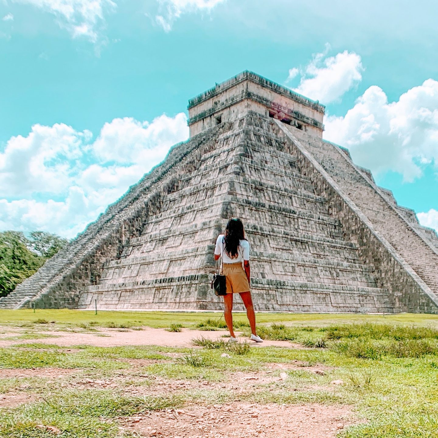 kira standing in front of El Castillo in Chichén Itzá